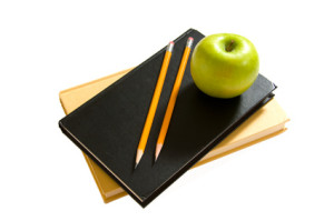 School books and apples