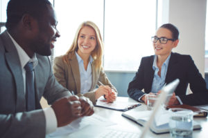 Business coach talking to two women